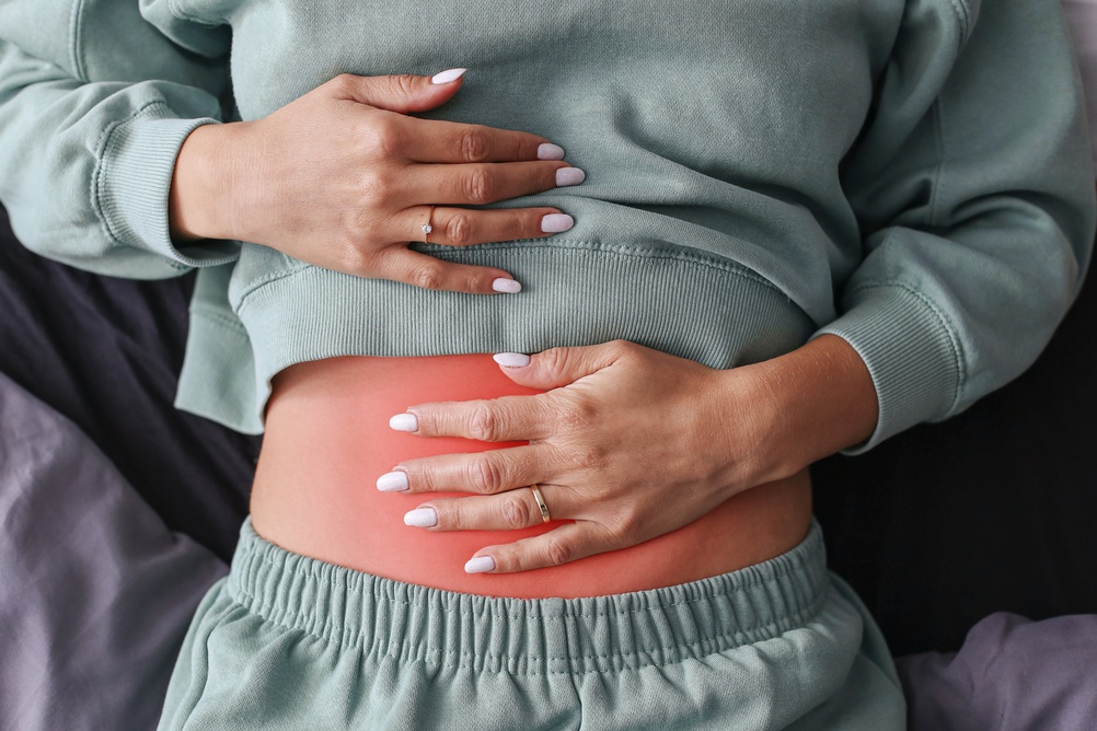 Woman,Holding,Painful,Stomach,Area.,Red,Highlighted,Abdomen,Shows,Digestive
